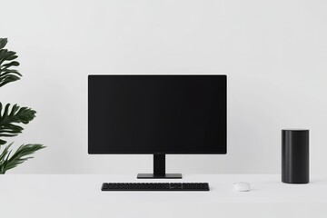 Fototapeta premium A black computer monitor sits on a desk next to a keyboard and mouse