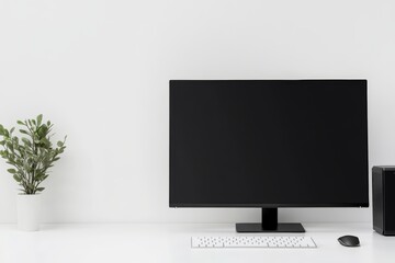 A black computer monitor sits on a desk next to a keyboard and mouse
