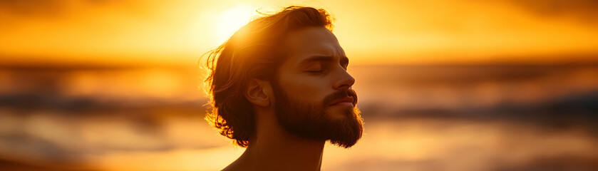 Man Silhouetted in Golden Sunset, Peaceful Beach Scene