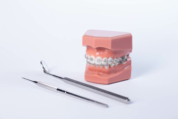 Orthodontic tools, brace, bracket system, tooth