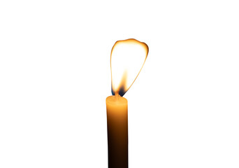 A single burning candle flame or light glowing on a small white candle isolated with clipping path in png file format