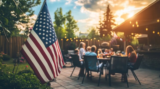 American flag on a patio full of guests enjoying a Memorial Day barbecue, children playing in the background. American family and friends celebrating the 4th of July, Independence Day