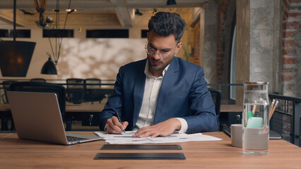 Arabian Indian man ethnic businessman employee manager analyst male office worker writing tasks...