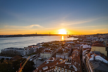 Breathtaking sunset over Lisbon with river views and colorful rooftops