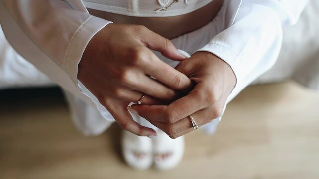 The girl touches the ring that is worn on her fingers. Close-up hand shots