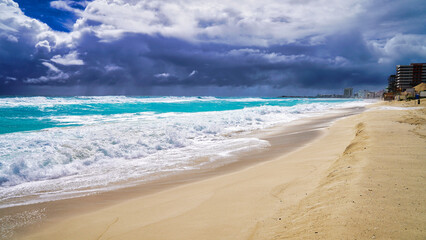 Playa Delfines beach in Cancun with powdery silver sands and Turquoise blue waters of the caribbean sea,during the October hurricane season in the Hotel Zone of Cancun,Quintana Roo,Mexico 