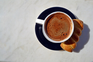 A cup of greek or turkish coffee and a sippet from above.