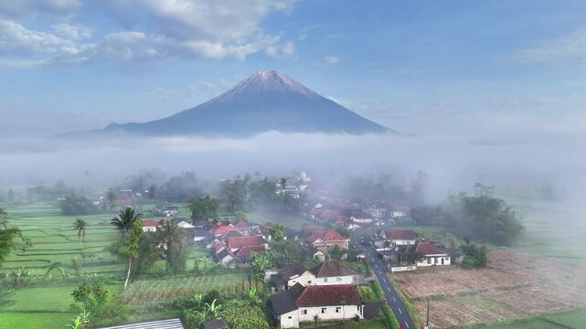 Stunning aerial view of the dramatic mountains, mount semeru in east java indonesia. Beautiful nature drone flying over tranquil countryside revealing beautiful natural views.
