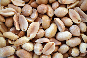 Close up of peeled and salted peanuts.