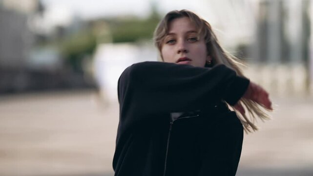 Young woman dancing hip hop on the street.