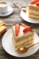 Piece of delicious carrot cake on wooden table, closeup