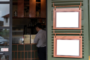 Mockup billboards or white promotion poster displayed on the front of the restaurant, coffee.