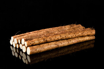 Fresh chinese yam ingredients on black background.