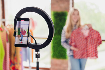 Photo of pretty girl vlogger online selling clothes on social media live stream daylight indoors
