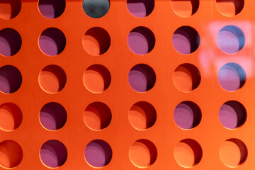 Dark red circles on a red background, wall decoration.