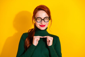 Photo of smart clever lady dressed green jumper nerd eyeglasses feeling shy empty space isolated...
