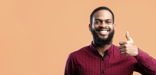 I Like It Concept. Headshot Closeup Portrait Of Smiling African American Guy Gesturing Thumbs Up At...