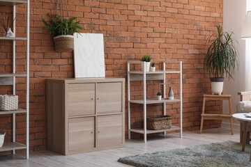 Chest of drawers and shelving units in interior of living room