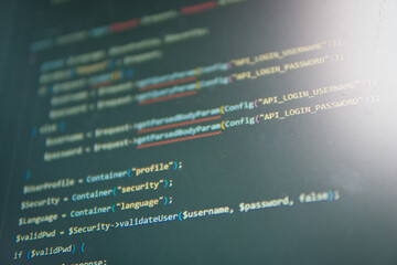 Code in the Spotlight:  A close-up shot of lines of code on a computer screen, illuminated by a...