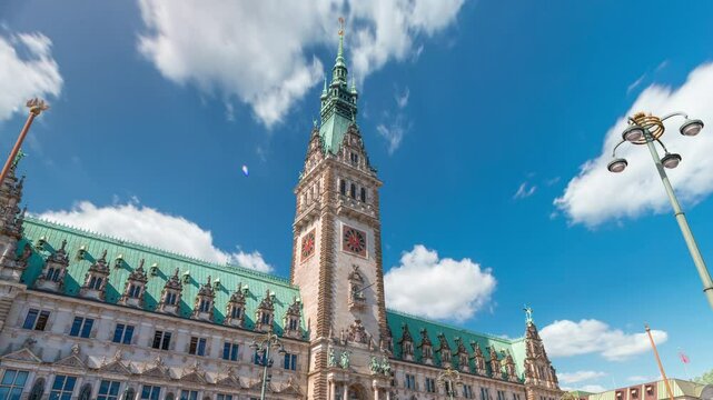 Building of the Hamburg City Hall timelapse, the seat of the government of Hamburg, located in the Altstadt quarter in the city center. Front view from the main square under a cloudy sky