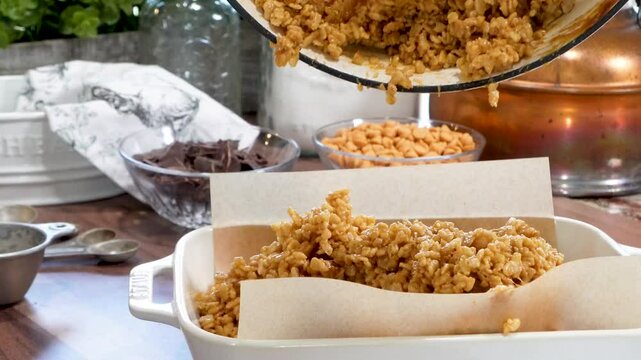 Baking rice krispy treats with butterscotch and chocolate on top. Fun chocolate sweet treats for grown ups and kids.  Chocolate rice krispy treats.