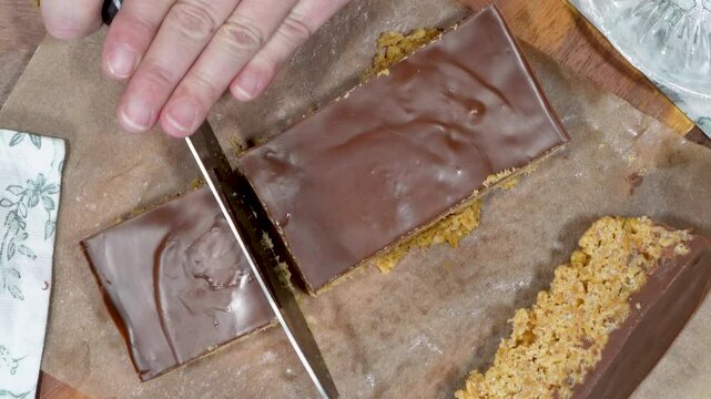 Baking rice krispy treats with butterscotch and chocolate on top. Fun chocolate sweet treats for grown ups and kids.  Chocolate rice krispy treats.