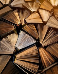 A captivating collection of aged books, their pages fanned out like sunlit feathers.