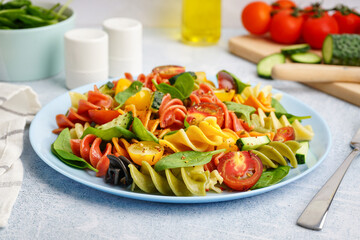 Plate with Italian pasta salad on table