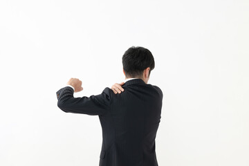 ビジネスマン　肩凝り　体調不良