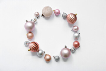 Frame made of Christmas balls on white background