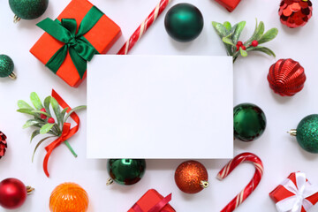 Blank card with Christmas decor and gift boxes on white background