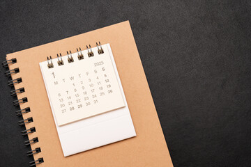 Simple desk calendar for JANUARY 2025 with office supplies. Calendar concept with copy space. 2025 JAN calendar.