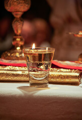 candle oil lights lit flame, ceremony in the altar , orthodoxy symbolism, religious icon,
