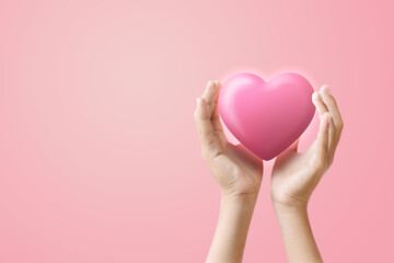 A pair of hands gently cradling a pink heart, symbolizing love, care, and emotional connection in branding or healthcare.