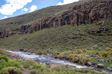 A small river in a mountain landscape in the Kingdom of Lesotho image in horizontal format