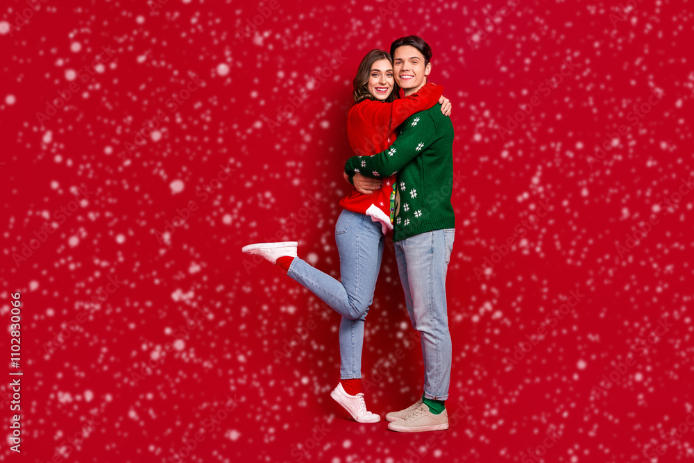 Poster full size portrait of two peaceful lovely partners hug embrace empty space isolated on red color bac