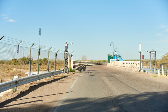 Empty road, entrance to the Carrizal Dam, in Mendoza, Argentina