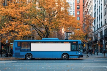 Obraz premium A blue bus parked on a city street with a blank white advertisement space on its side