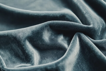 macro shot of soft blue velvet fabric, showcasing its rich texture and luxurious feel. gentle folds create elegant appearance, perfect for upholstery or fashion