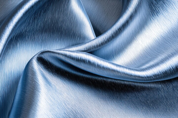 Naklejka premium Satin fabric in brushed blue texture, showcasing smooth and shiny surface. elegant folds create luxurious feel, perfect for fashion and interior design