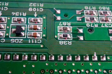 electronic circuit board with the back side, on which the soldering and connecting tracks of radio...