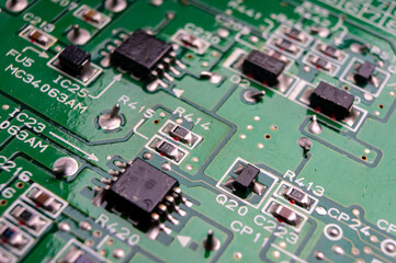 electronic circuit board with the back side, on which the soldering and connecting tracks of radio...