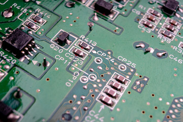 electronic circuit board with the back side, on which the soldering and connecting tracks of radio...
