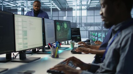 Programmer seeing red critical error popup on computer display in data center, panicking. African american man in server hub spamming keyboard buttons after receiving error, camera A - Powered by Adobe