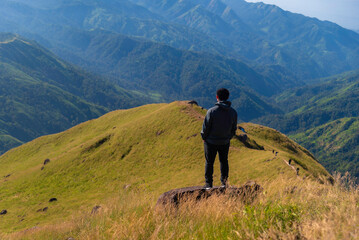 Hiker asian happy feeling freedom good and strong weight victorious facing on the natural mountain. Travel Concept