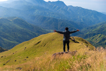 Hiker asian happy feeling freedom good and strong weight victorious facing on the natural mountain. Travel Concept