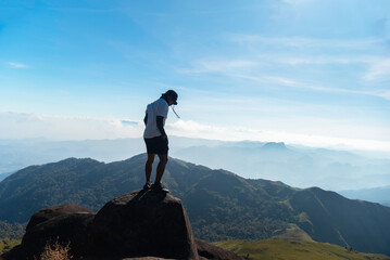 Hiker asian happy feeling freedom good and strong weight victorious facing on the natural mountain. Travel Concept