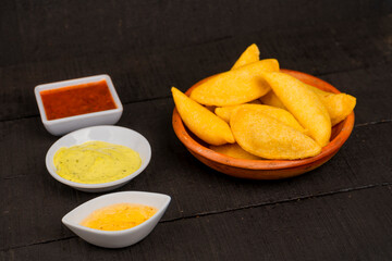 Delicious traditional Colombian empanadas with spicy sauce