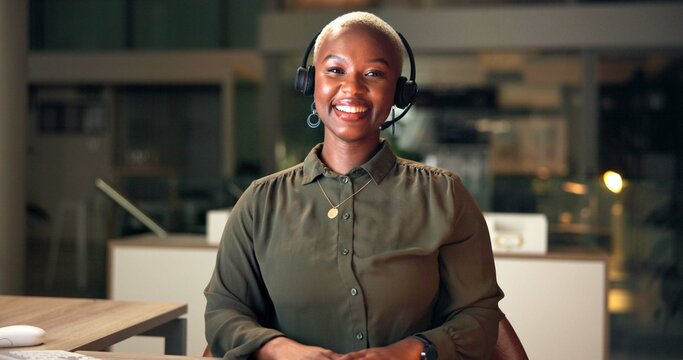 Call center, happy black woman and portrait for customer service or support at help desk at night. Face, smile and receptionist in office for telemarketing, professional business or overtime in Kenya