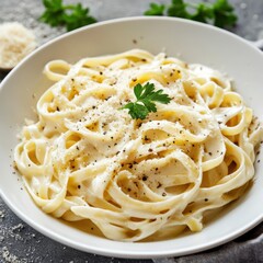 A rich and creamy Alfredo pasta with fettuccine noodles, parmesan cheese, and a touch of garlic